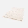 Alcatifa interior tufada em creme com relevo claro