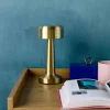 Candeeiro de mesa LED em metal dourado