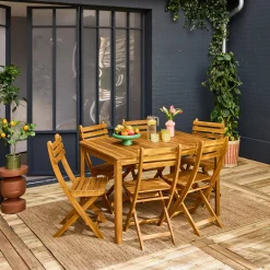 Conjunto de jardim com mesa em madeira de acácia com cantos arredondados com 6 cadeiras