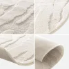 Tapete interior com forma de seixo com relevo creme